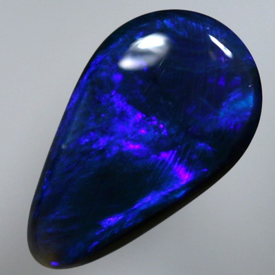 SOLID BLACK OPAL Royal blue moving in rollling flashes